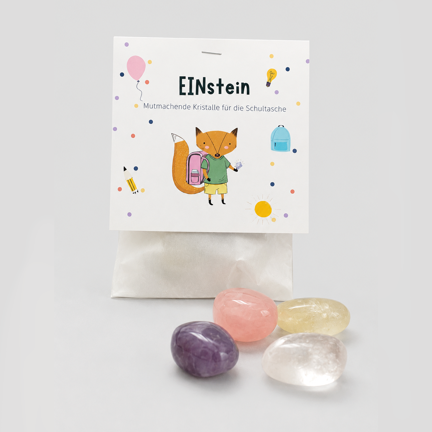 EINstein Set Verpackung mit Fuchs-Illustration und vier bunten Kristallen davor