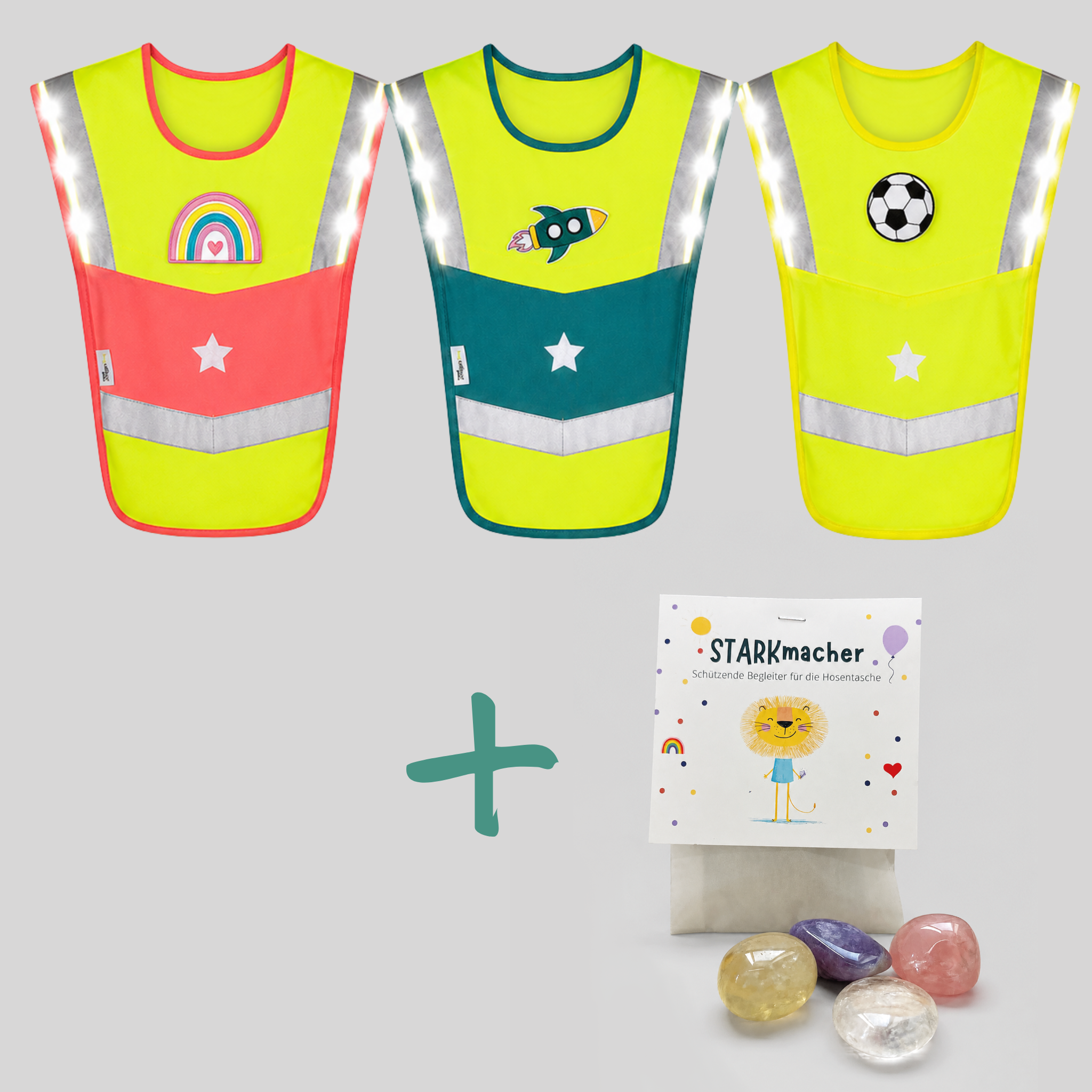 Drei LED-Warncapes in Pink, Petrol und Gelb mit Patches, kombiniert mit dem STARKmacher Kristalle Set